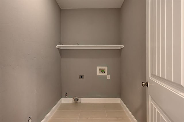 laundry room with laundry area, hookup for a washing machine, baseboards, hookup for a gas dryer, and electric dryer hookup