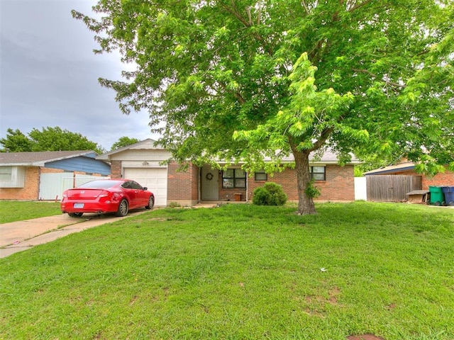 3205 S Madole Blvd, Oklahoma City, OK 73159 - view of front of home featuring a garage, brick siding, and concrete driveway