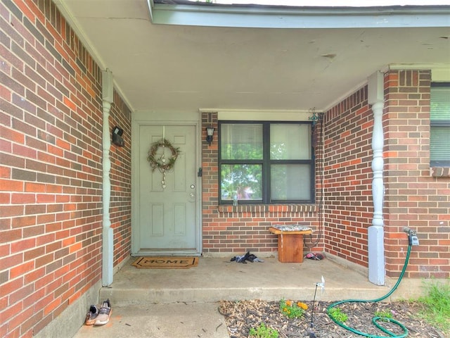 3205 S Madole Blvd, Oklahoma City, OK 73159 - doorway to property with brick siding and a porch