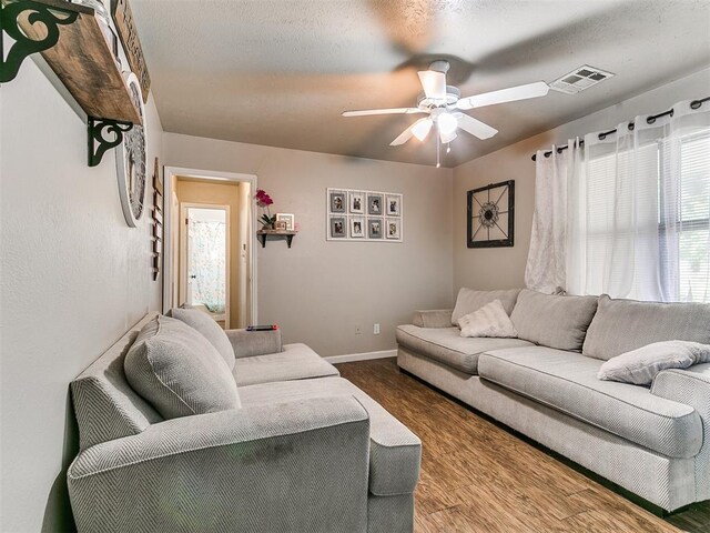 3205 S Madole Blvd, Oklahoma City, OK 73159 - living room featuring wood finished floors, a ceiling fan, and baseboards