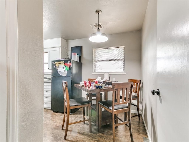 3205 S Madole Blvd, Oklahoma City, OK 73159 - dining area with wood finished floors and baseboards