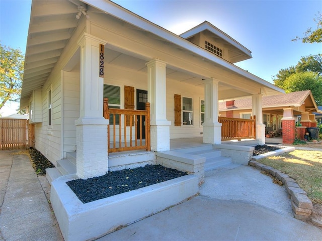 property entrance with covered porch