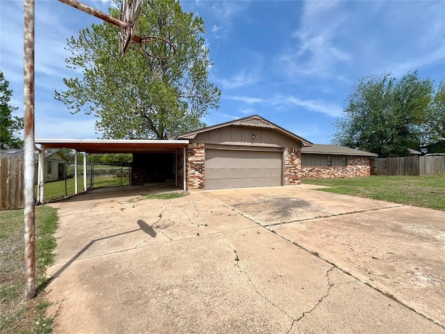 136 Skyline Dr, Chickasha, OK 73018 - single story home with a front yard, a carport, a garage, fence, and driveway