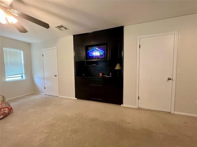 136 Skyline Dr, Chickasha, OK 73018 - unfurnished bedroom featuring light colored carpet, baseboards, and visible vents