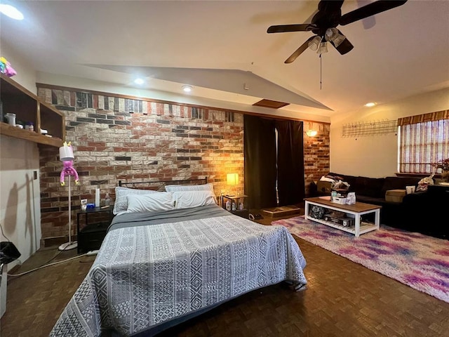 136 Skyline Dr, Chickasha, OK 73018 - bedroom with wood finished floors, vaulted ceiling, and brick wall