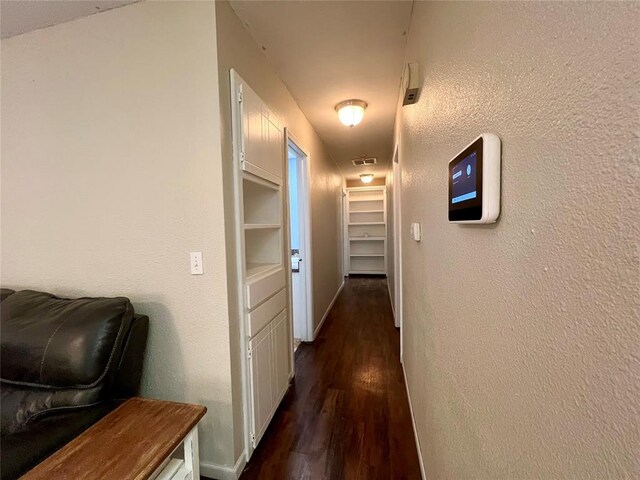 136 Skyline Dr, Chickasha, OK 73018 - corridor with dark wood-style flooring, baseboards, and visible vents
