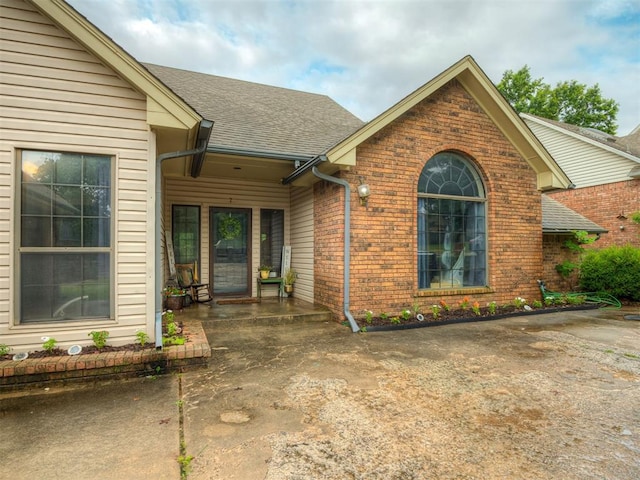 7 Kaross Dr, Shawnee, OK 74801 - view of front of home with brick siding and a shingled roof