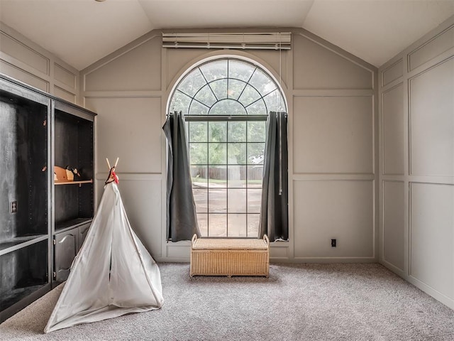 7 Kaross Dr, Shawnee, OK 74801 - playroom featuring a decorative wall, lofted ceiling, and carpet