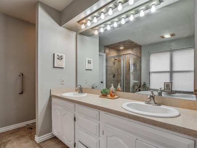 7 Kaross Dr, Shawnee, OK 74801 - bathroom with a stall shower, double vanity, and tile patterned floors