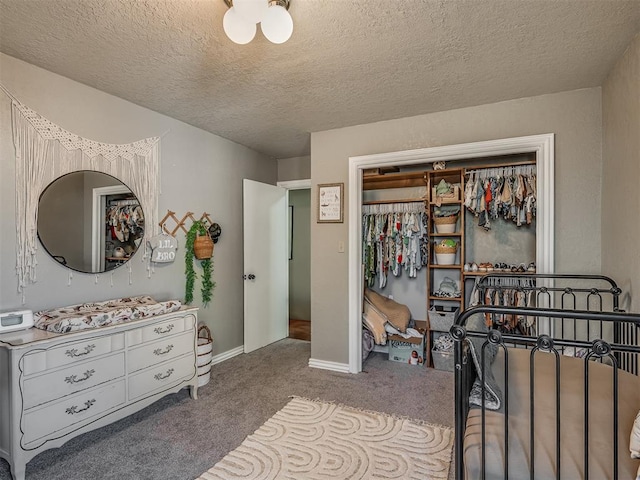 7 Kaross Dr, Shawnee, OK 74801 - bedroom featuring carpet floors, a textured ceiling, and a closet
