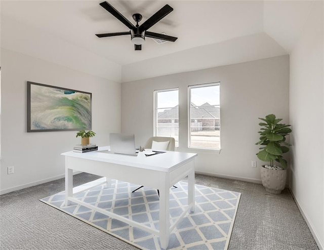 office space with light carpet, baseboards, and a ceiling fan
