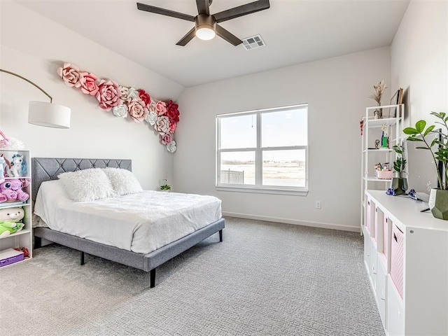 bedroom featuring ceiling fan, visible vents, light carpet, lofted ceiling, and baseboards