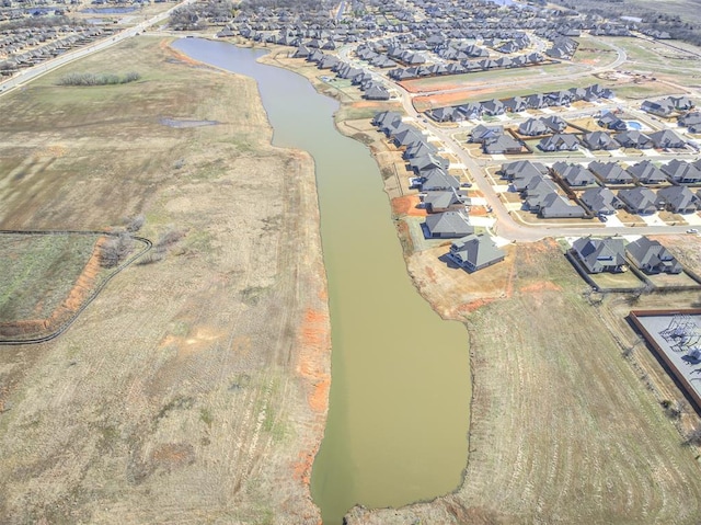 bird's eye view with a water view and a residential view