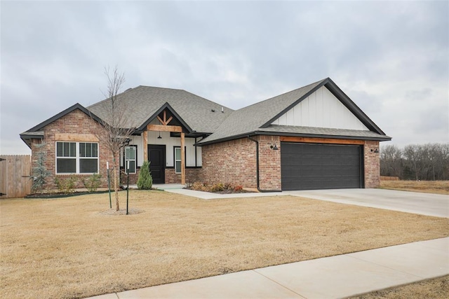 view of front of home with an attached garage, roof with shingles, driveway, and brick siding