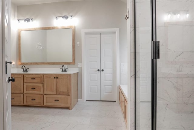 full bath with a sink, a shower, marble finish floor, and double vanity