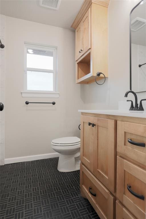 full bath featuring walk in shower, vanity, visible vents, and toilet