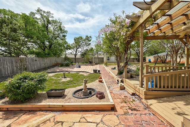 1113 Bank Side Cir, Edmond, OK 73012 - view of yard featuring a fenced backyard, a pergola, and a deck