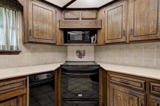 1113 Bank Side Cir, Edmond, OK 73012 - kitchen with light countertops, backsplash, and black appliances