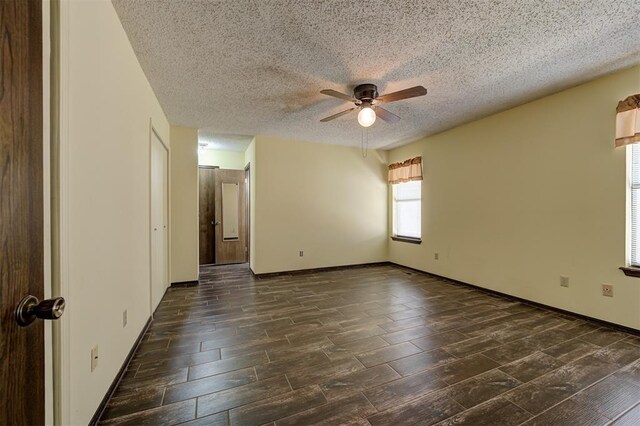 1113 Bank Side Cir, Edmond, OK 73012 - spare room with baseboards, a ceiling fan, wood finish floors, and a textured ceiling