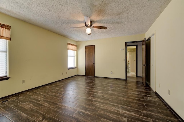 1113 Bank Side Cir, Edmond, OK 73012 - spare room with ceiling fan, baseboards, wood finished floors, and a textured ceiling