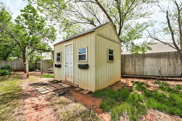 1113 Bank Side Cir, Edmond, OK 73012 - view of shed featuring a fenced backyard