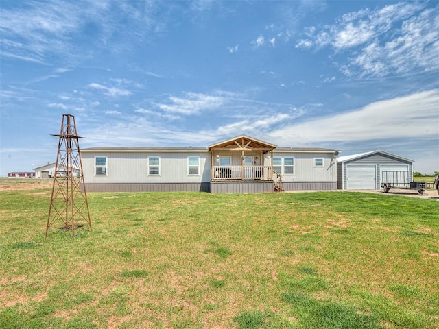 28737 Oakwood Meadows Dr, Cashion, OK 73016 - view of front of property featuring a garage, a front lawn, and an outdoor structure