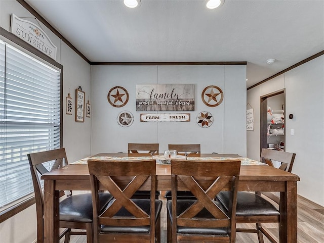 28737 Oakwood Meadows Dr, Cashion, OK 73016 - dining space featuring light wood-style floors and ornamental molding