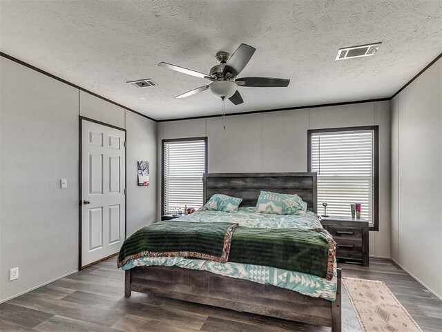 28737 Oakwood Meadows Dr, Cashion, OK 73016 - bedroom with visible vents, multiple windows, and wood finished floors