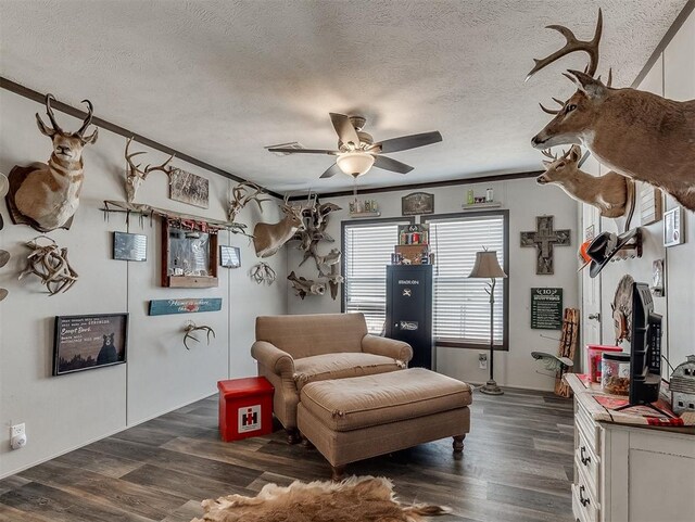 28737 Oakwood Meadows Dr, Cashion, OK 73016 - living area with dark wood-style floors, a textured ceiling, and a ceiling fan