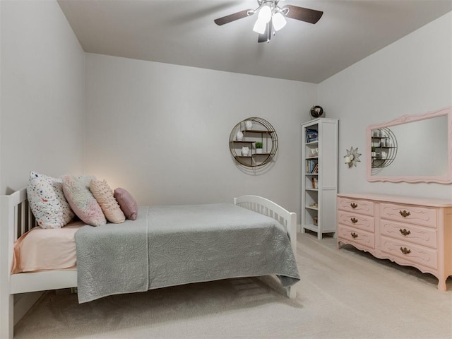 bedroom with ceiling fan and light colored carpet