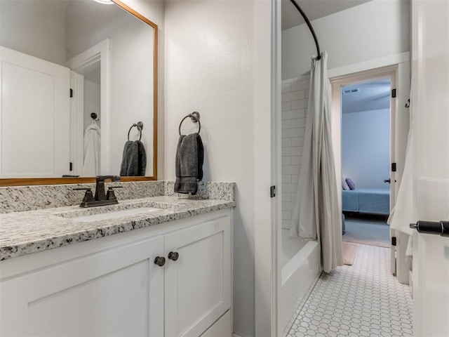 bathroom featuring visible vents, shower / bath combo, and vanity