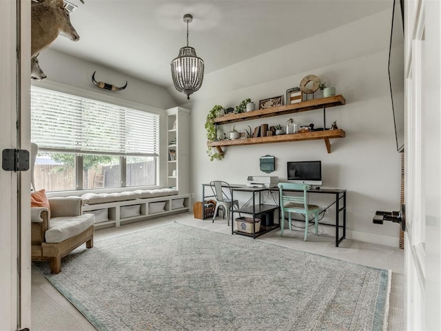 office featuring baseboards and an inviting chandelier