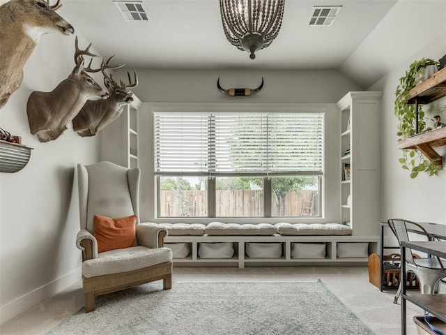 sitting room with baseboards, light carpet, and visible vents