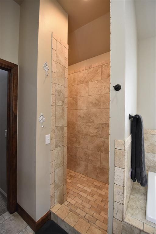 full bathroom featuring tiled shower