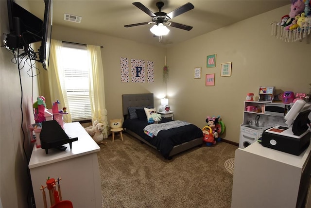 bedroom with carpet flooring, ceiling fan, and visible vents