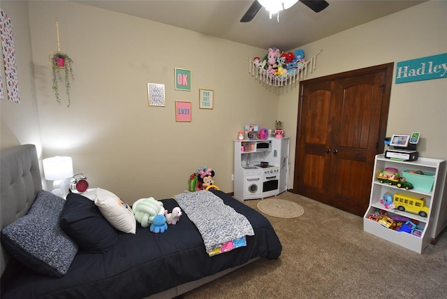 carpeted bedroom featuring a closet and ceiling fan