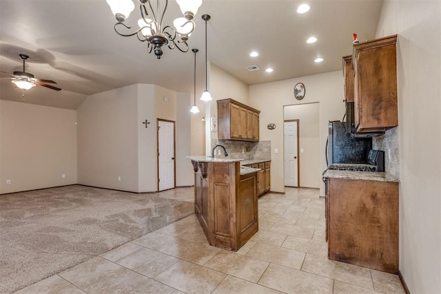 3719 Black Forrest Ct, Newcastle, OK 73065 - kitchen featuring ceiling fan with notable chandelier, brown cabinetry, a peninsula, tasteful backsplash, and open floor plan