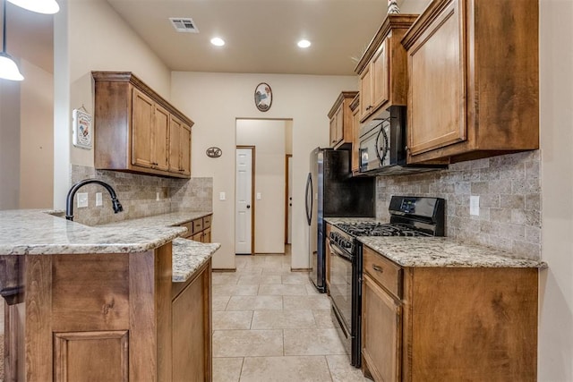 3719 Black Forrest Ct, Newcastle, OK 73065 - kitchen featuring a peninsula, visible vents, brown cabinets, and black appliances