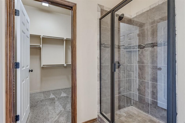 3719 Black Forrest Ct, Newcastle, OK 73065 - full bathroom with a stall shower, baseboards, and a walk in closet
