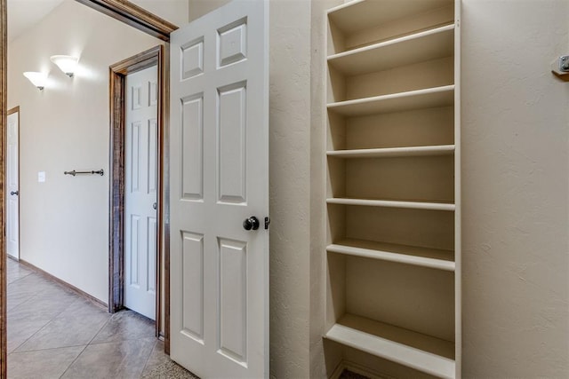 3719 Black Forrest Ct, Newcastle, OK 73065 - hallway featuring a textured wall and tile patterned floors