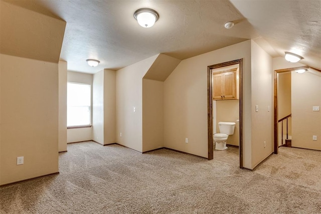 3719 Black Forrest Ct, Newcastle, OK 73065 - additional living space featuring a textured ceiling, light colored carpet, baseboards, and lofted ceiling
