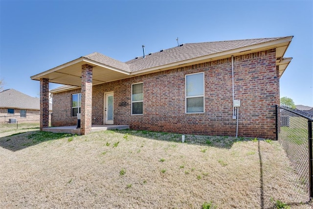 3719 Black Forrest Ct, Newcastle, OK 73065 - back of house with a patio, brick siding, a yard, and fence