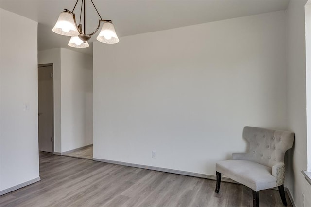 2621 NW 121st St, Oklahoma City, OK 73120 - unfurnished room featuring baseboards, a chandelier, and light wood-type flooring