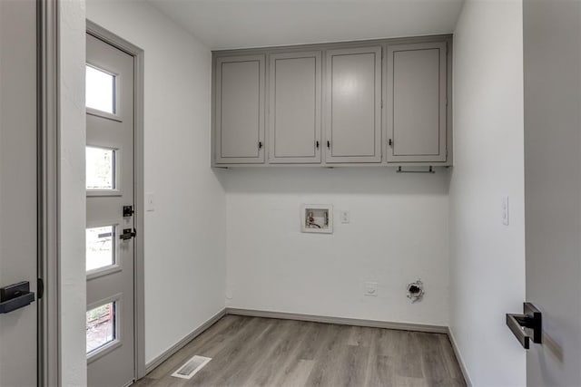 2621 NW 121st St, Oklahoma City, OK 73120 - washroom with hookup for a washing machine, electric dryer hookup, light wood-style floors, cabinet space, and visible vents