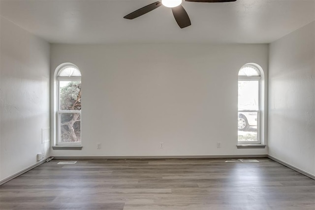 2621 NW 121st St, Oklahoma City, OK 73120 - empty room featuring wood finished floors and ceiling fan