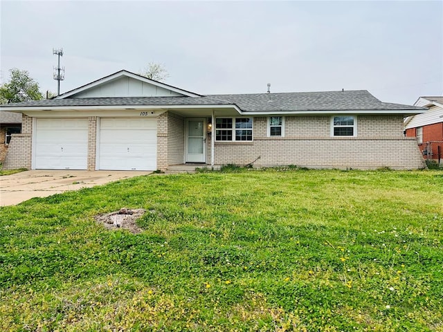 single story home featuring brick siding, an attached garage, a front lawn, and concrete driveway