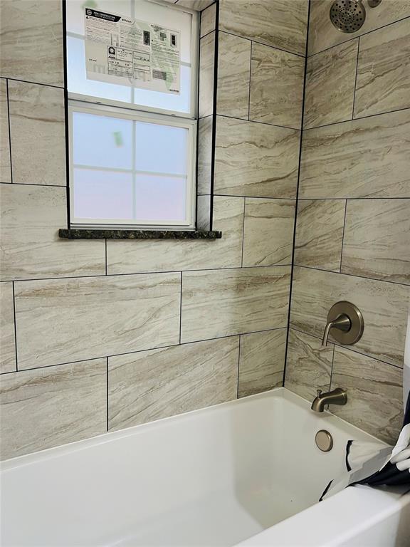 bathroom featuring shower / tub combination