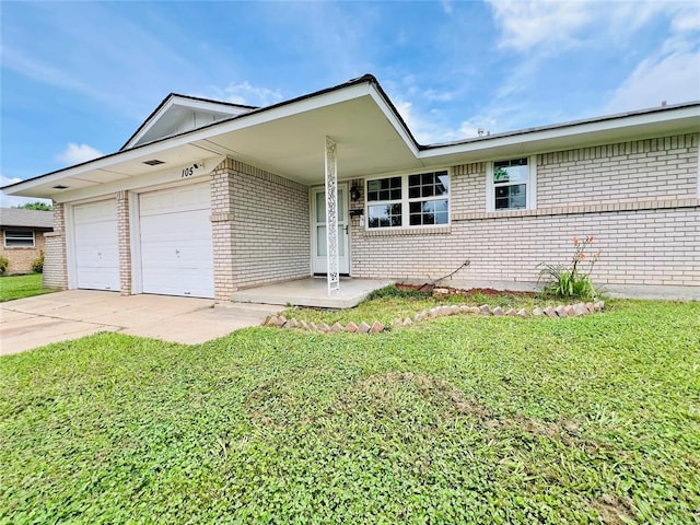 105 SW 6th St, Moore, OK 73160 - single story home featuring brick siding, a garage, a front yard, and driveway