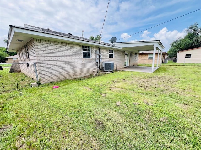 105 SW 6th St, Moore, OK 73160 - back of house featuring a patio and brick siding