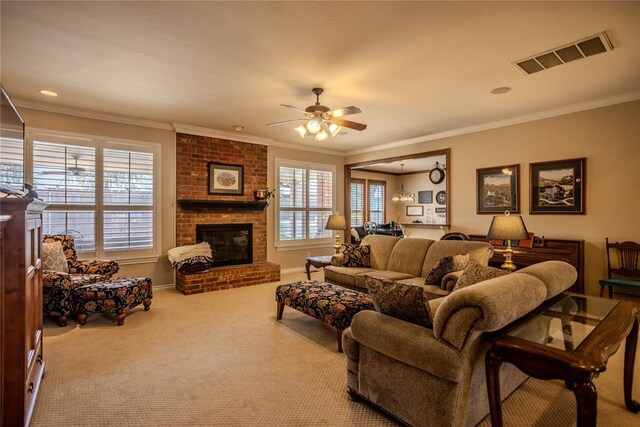 carpeted living area featuring a wealth of natural light, visible vents, a fireplace, and ornamental molding